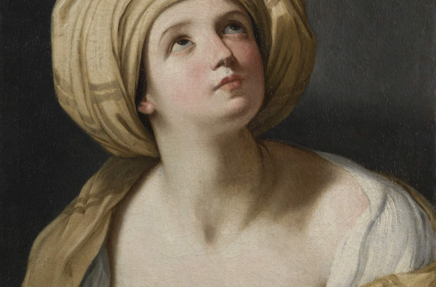 Młoda kobieta w żółtym turbanie spoglądająca ku górze